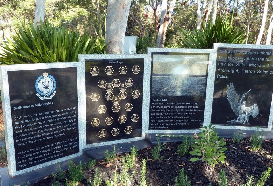 NSW Police Force 9 April 2015 NSW Police Commissioner Andrew Scipione has officially dedicated a new memorial honouring fallen officers in the St George and Sutherland Shire.  The Commissioner was joined by local police, families, friends, and colleagues, for the dedication of the NSW Police Memorial, led by Police Chaplain, Reverend David Warner, at Woronora Cemetery today (Thursday 9 April 2015).  The memorial honours 24 NSW Police officers who have died on duty while serving in the St George, Sutherland and Miranda Local Area Commands or who were cremated or laid to rest at Woronora Cemetery.  Commissioner Scipione said the plaques and memorial wall is a perfect way to honour local officers who have made the ultimate sacrifice.  “The NSW Police Memorial at Woronora Cemetery is our first collective police tribute in a private cemetery,” Commissioner Scipione said.  “As we unveil the plaques today, we reflect on the lives and achievements of the officers who died while serving this community.  “One of the toughest challenges for police is starting work each day not knowing what will happen yet understanding they may have to risk their own life to save another.  “It is with great pride I dedicate this memorial and honour the officers, whose names are inscribed, remembering their selfless sacrifice and courage. They will not be forgotten,” Commissioner Scipione said.  The names of the 24 local fallen officers, who died on duty since 1862, are inscribed on the wall of the memorial.  An additional two colonial police killed in 1845, prior to the inception of the NSW Police Force, will also be remembered in the form of separate plaques.   The NSW Police Memorial is a joint project of Woronora General Cemetery and Crematorium, Southern Metropolitan Associates Branch of the Police Association of NSW and the NSW Police Force.  Officers honoured on NSW Police Memorial at Woronora Cemetery:  Sergeant 1st Class William Smith, killed on duty at Port Kembla on 1 September 1951, age 53  Constable Garnet Mortley, killed on duty at Waterfall 1 June 1953, age 25  Constable Edward Dilks, killed on duty at Corowa on 21 October 1954, age 28  Sergeant 2nd Class Cecil Ellis, killed on duty at Sydney on 29 April 1956, age 58  Constable William Lord, killed on duty at Randwick on 23 December 1958, age 24  Constable Colin Robb, killed on duty at Auburn on 7 September 1963, age 28  Constable 1st Class Cyril Howe, killed on duty at Oaklands on 20 December 1963, age 31  Constable Allan Shaw, killed on duty at Belmore on 11 May 1964, age 24  Constable Colin Roy, killed on duty at Kirrawee on 12 May 1967, age 28  Sergeant 2nd Class Adam Schell, killed on duty at Bobbin Head on 8 October 1968, age 52  Probationary Constable Warren Burns, killed on duty at Sutherland on 30 October 1968, age 25  Detective Senior Constable Denis Ware, killed on duty at Sutherland on 2 October 1970, age 32  Constable Joseph Gibb, killed on duty at Miranda on 23 January 1972, age 28  Senior Constable Neville Parker, killed on duty at Sans Souci on12 November 1972, age 34  Sergeant 2ns Class John Gill, killed on duty at Hurstville on 12 May 1973, age 47  Sergeant 1st Class John Colbert, killed on duty at Kingsgrove on 11 March 1979, age 58  Detective Sergeant Jillian Hawkes, killed on duty at Milsons Point on 22 April 1986, age 46  Probationary Constable Dana Heffernan, killed on duty at Randwick on 17 April 1987, age 20  Constable 1st Class Mark Burns, killed on duty at Tamworth on 17 March 1988, age 25  Constable John Burgess, killed on duty at Annandale on 27 April 1989, age 29  Constable Kenneth Short, killed on duty at Yarrawarra on 11 July 1990, age 27  Sergeant John Proops, killed on duty at Enfield on 22 May 1993, age 42  Senior Sergeant Raymond Smith, killed on duty at Calga on 13 July 1998, age 47  Senior Constable James (Jim) Affleck, killed on duty at Glen Alpine on 14 January 2001, age 43  Colonial police honoured:  Corporal Stephen Kirk, killed on duty at Heathcote on 12 November 1845, age 32  Trooper Luke Dunn, killed on duty at Heathcote on 21 November 1845, age 33