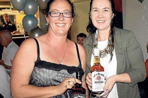 LADY LUCK: Jennie Wilcox presents Debbie White with her lucky door prizes. Debbie was very lucky on the night, also winning one of the raffle prizes, which she decided to donate back.