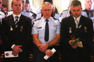 Ferny Grove Police station officers who worked with Constable Brett Andrew Irwin during the officer's funeral at the St Stephens Cathedral. Picture: AAP/Tony Phillips
