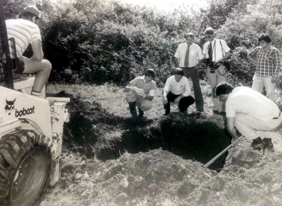 Looking for " Fine Cotton " Det.Sgt. Douglas Cecil Bentley ( crouching with black pants ), Det. Sgt. Carl Cameron ( standing behind Bentley ) & Allan Tutt ( crouching with shovel ), exhuming a horse, not Fine Cotton in that hole.