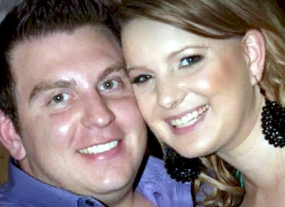 Australian Joshua Paroci, pictured with his wife, who is also a police officer.