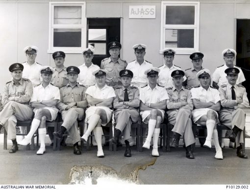  c1965DescriptionFormal portrait of RAN and RAAF officers at the RAN/RAAF Australian Joint Anti-Submarine School (AJASS) at HMAS Albatross at Nowra NSW. The only identified officer is O210106 Flight Lieutenant David Valentine Paul DFC RAAF at front row far left. Flt Lt Paul enlisted on 4 January 1941 and trained as a pilot with the Empire Air Training Scheme (EATS) in Rhodesia. He was posted to 454 Squadron RAAF. Flying a Baltimore aircraft from a base in North Africa he was shot down on 4 December 1943 during a sortie over the Mediterranean. Rescued from the sea he became a prisoner of war (POW) of the Germans, finally being released in 1945 at Stalag IVb POW camp in 1945 at Muhlberg, Germany. He joined the NSW Police Force after the war and remained in the RAAF Reserve rising to the rank of Squadron Leader.