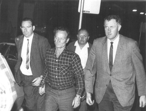 Det Sgt Bob McNamara ( father of Bradley McNamara ( RIP ), offender Darcy Dugan, Fred 'the Spy' Smith and Adrian Allingham - handcuffed to Dugan.