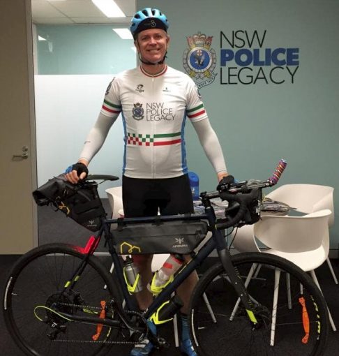 Senior Constable Anthony New at Newtown Police Station rides his bike cross country for his colleague battling cancer.