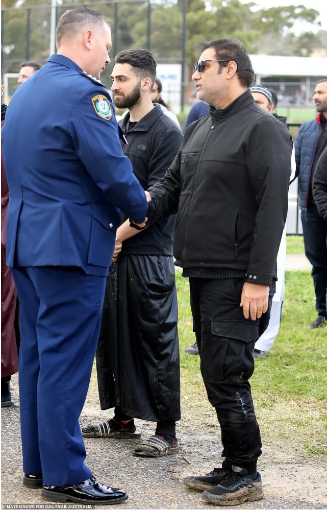 Tanzeel Iftikhar BASHIR. Iftikhar Bashir (right) was consoled by his son’s police colleagues who formed a line to offer their condolences at Narellan Cemetery.