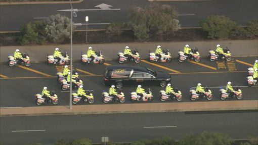The service concluded with a police honour guard. Credit: 7NEWS